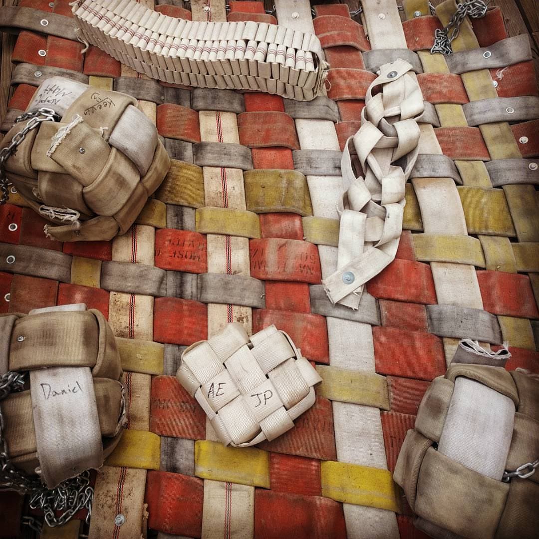 A collection of animal toys made out of recycled firehose