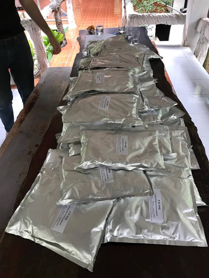 A stack of bagged supplements for rescued tigers