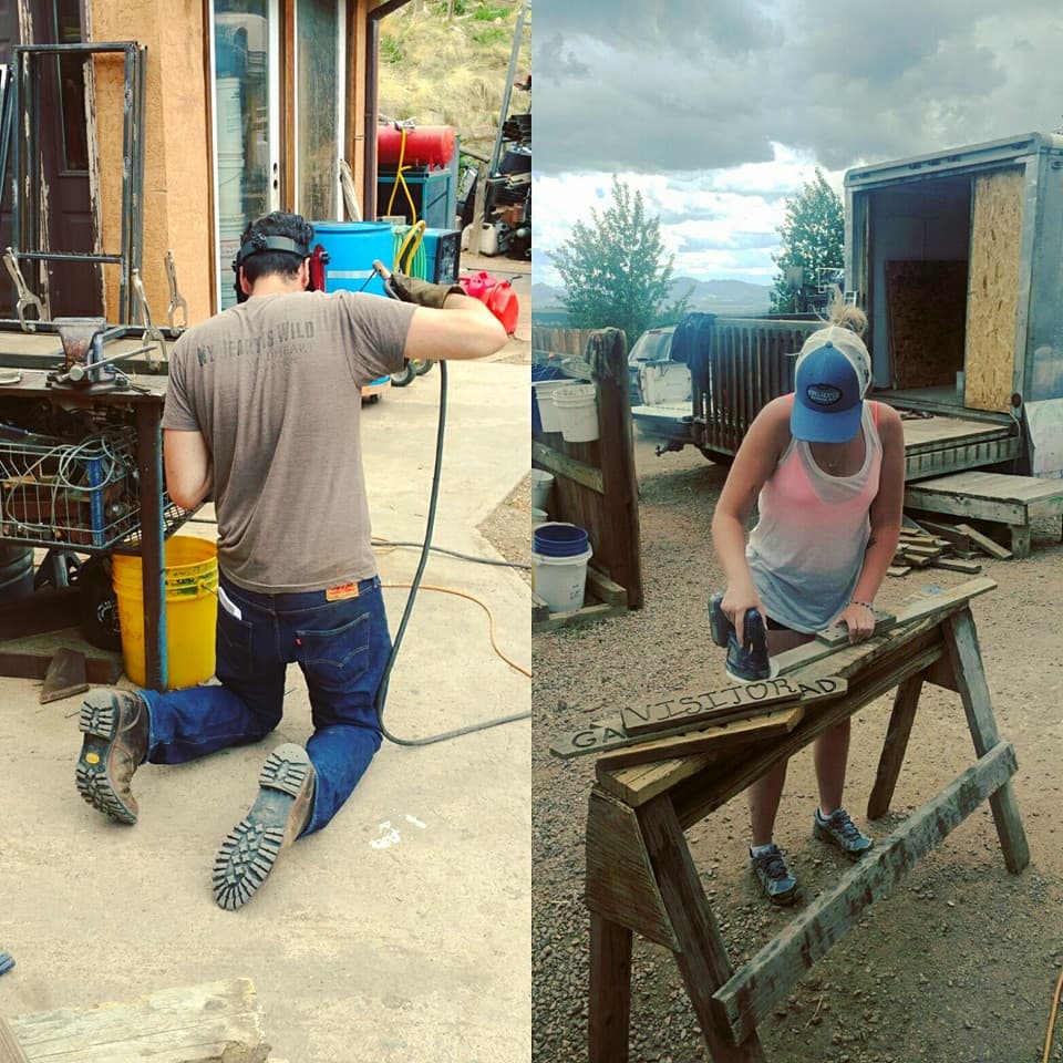 Volunteers using a welder and sander to build new enclosures